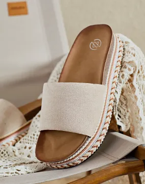 Mules beige en suédine à grosse plateforme à motifs