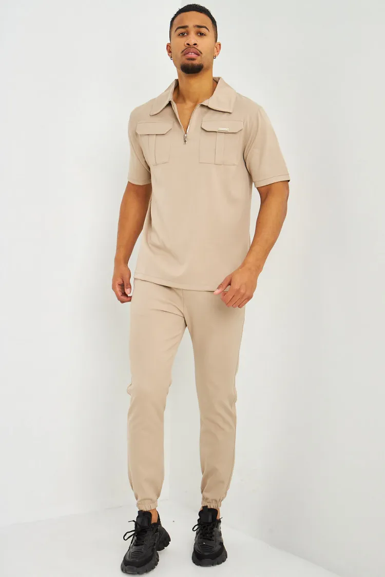 Polo uni beige col zippé à poches