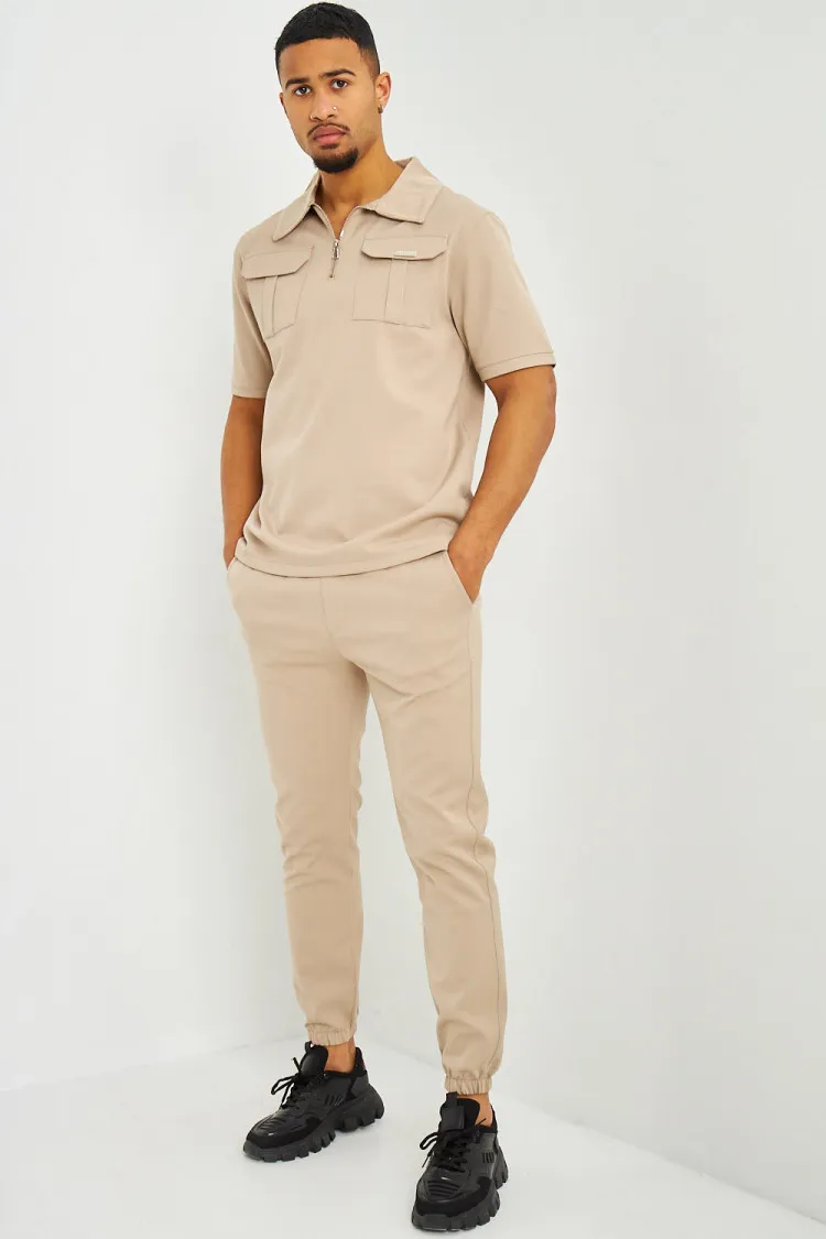 Polo uni beige col zippé à poches