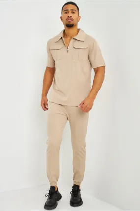 Polo uni beige col zippé à poches